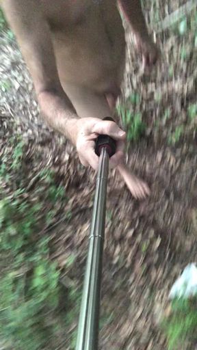 Behind my house in the woods walking around naked