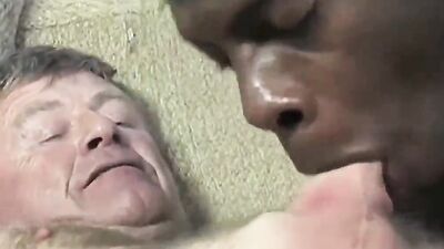 Old white guy is poked in the ass with a big black cock