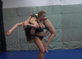 Strong lezdom Princess Nikki in a black lingerie lifts the brunette and proves how strong she is