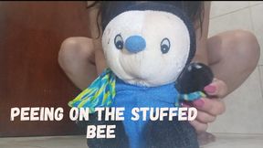 Peeing on the stuffed bee