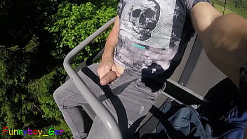 In a moving chair lift I jerk my hot cock from soft to hard and then cum. Public fun outside in the Bavarian Alps.