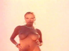 Blonde is flashing her big boobs in the outdoors