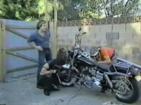 Blonde filthy babe with sunglasses feeding on a dick of a biker