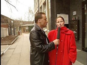 Brunette german lady interviewed outdoors