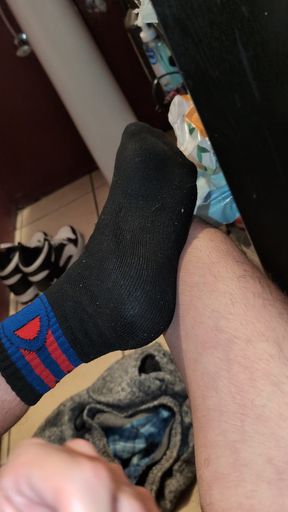 Jacking off naked in my black and red socks