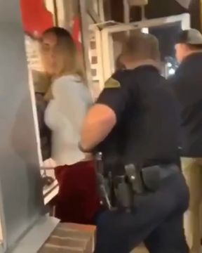 Police arresting woman in restaurant