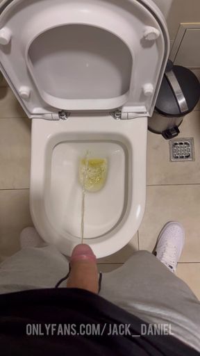 GUY PISSING IN TOILET