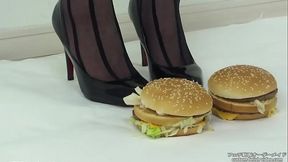 Foodcrush A woman steps on a hamburger with stockings