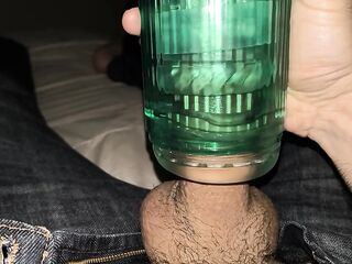 Suction toy on the bed sheets with jeans on and cumming outside