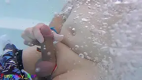 With a band around my penis and balls, I jerk off riskily in a public whirlpool