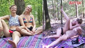 Tattooed babe Ida sucks cock with her feet in outdoor lesbian strap-on action