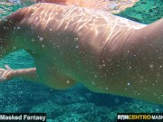 Hot MILF undressing under water and swims naked in the sea with pussy closeup