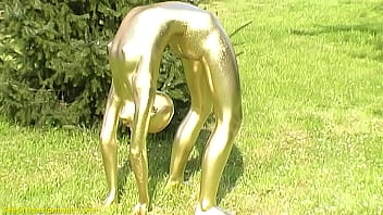 extreme flexible contortionist gets golden painted