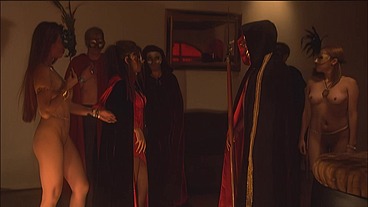 This masked brunette is chained to the bed and awaiting orders