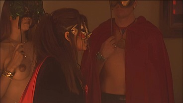 This masked brunette is chained to the bed and awaiting orders