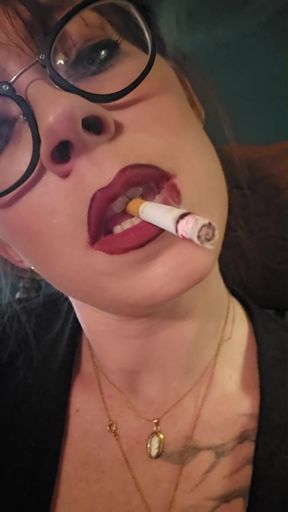 Smoking babe takes a sexy selfie up close