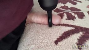 Jerking off my cock on the couch with a massager.
