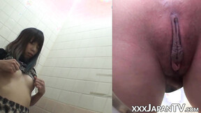 Naughty Japanese hot girl fingers her beaver in public toilet