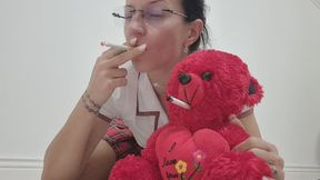 The teddy bear is getting smoking lessons