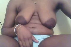 The big and flabby tits of this ebony webcam whore are freaky