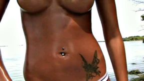 Check out this stunning Latina with small tits getting naked on the beach in a thong and piercing