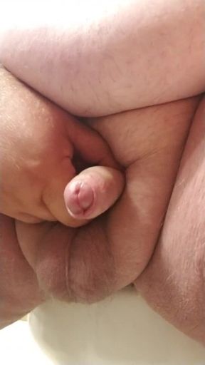 Close up of tiny cock jerking off