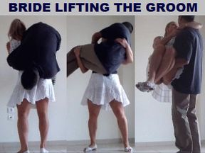BRIDE LIFTING THE GROOM