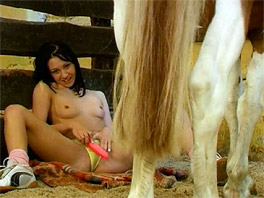 Michelle plays with her pussy in the stables