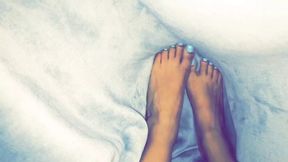 Tiny feet under the covers