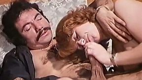 Cute redhead classic lady on the bed eating nice big cock