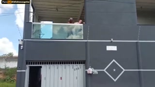 Neighbor films couple having sex on the balcony of the building she moans a lot