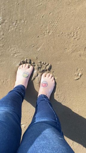 Toes in the wet sand