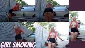 Girl in skirt smoking in car