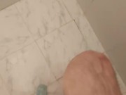 Boy showers in speedo swimsuit and soaps his feet