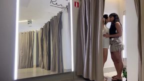 Hot brunettes making out in the mall fitting room
