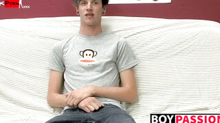 Adorable gay guy Danny jerks off his dick on couch solo