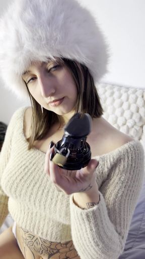 Woman in fur hat holding bottle