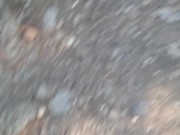 Taking a piss on a mountain road