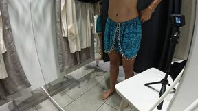 Girl undresses and touches herself in public in the dressing room of a clothing store.