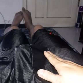 Pleasure wearing shiny slippery black shorts bulge