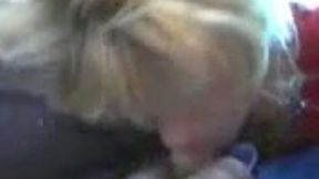 Tired looking blonde MILF oral fucks my sturdy cock in car