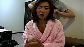 Sassy Japanese MILF Madoka Matsuba masturbates on the couch