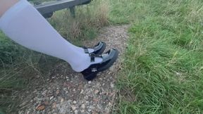 Public shoeplay, dangling and dipping in white knee socks and Mary Jane shoes