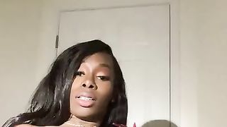 Suspended black t-model fapping her penis