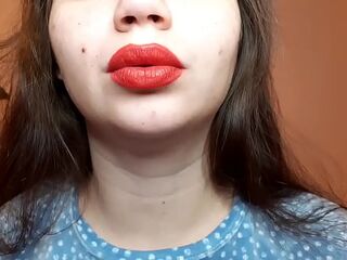 Natural lips with red lipstick smokin' a cigarette in close up