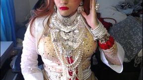 Crossdresser relaxing in pearls and heels