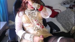 Crossdresser relaxing in pearls and heels