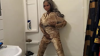 Doll Showers &amp_ Gets Golden Tracksuit Wet!