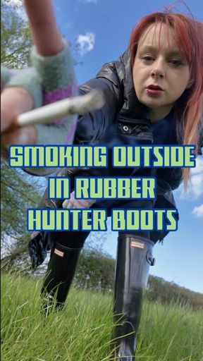 Smoking Outside In Rubber Hunter Boots