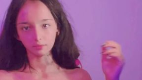 Beautiful Asian girl talks and teases, showing off her busty body